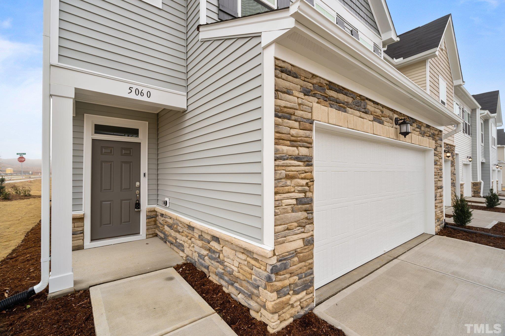 5060 Tura Street Raleigh, NC 27610 - Photo 13 of 50 a view of a house with a door and wooden floor