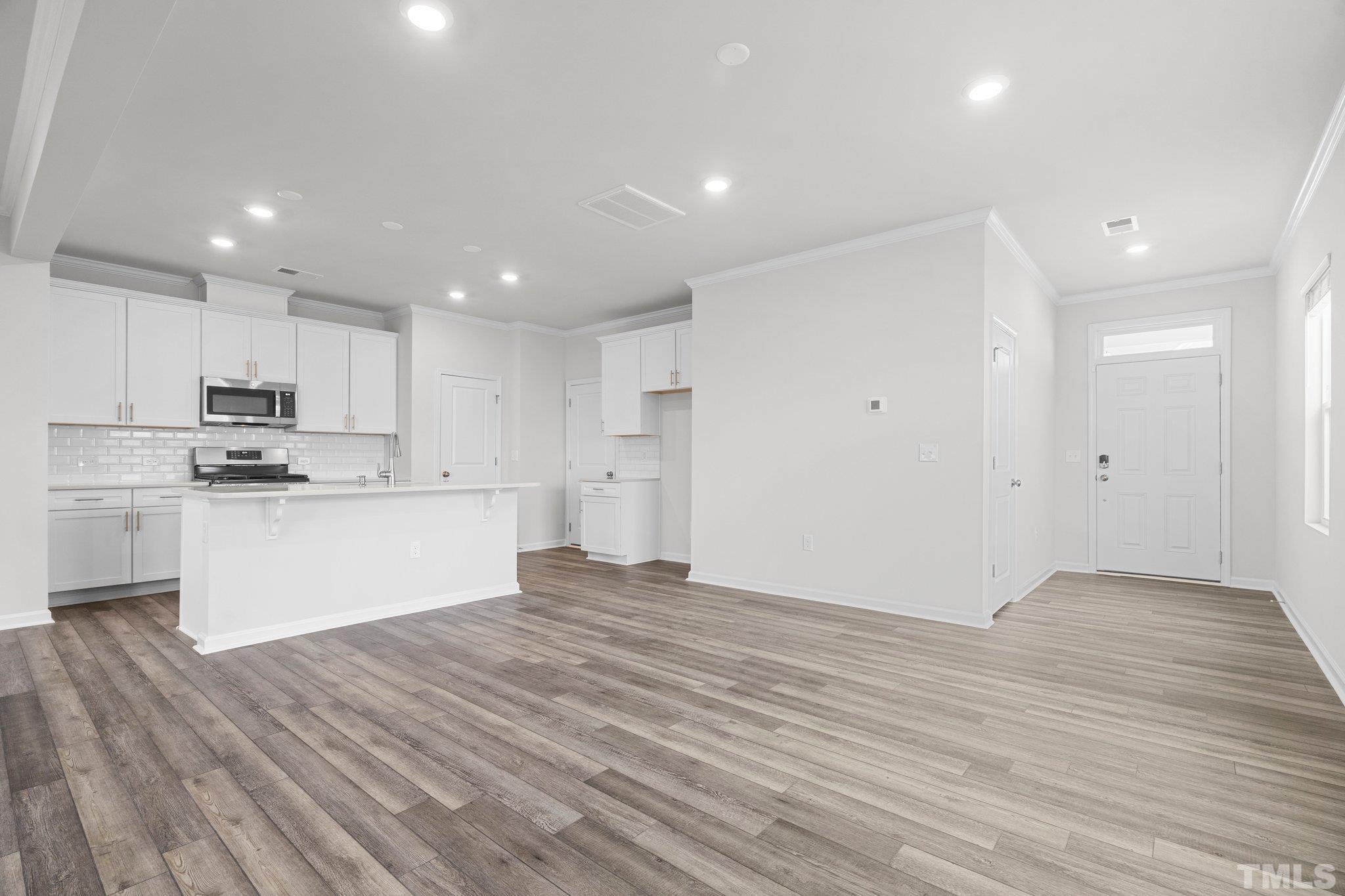 5060 Tura Street Raleigh, NC 27610 - Photo 18 of 50 a view of kitchen with wooden floor