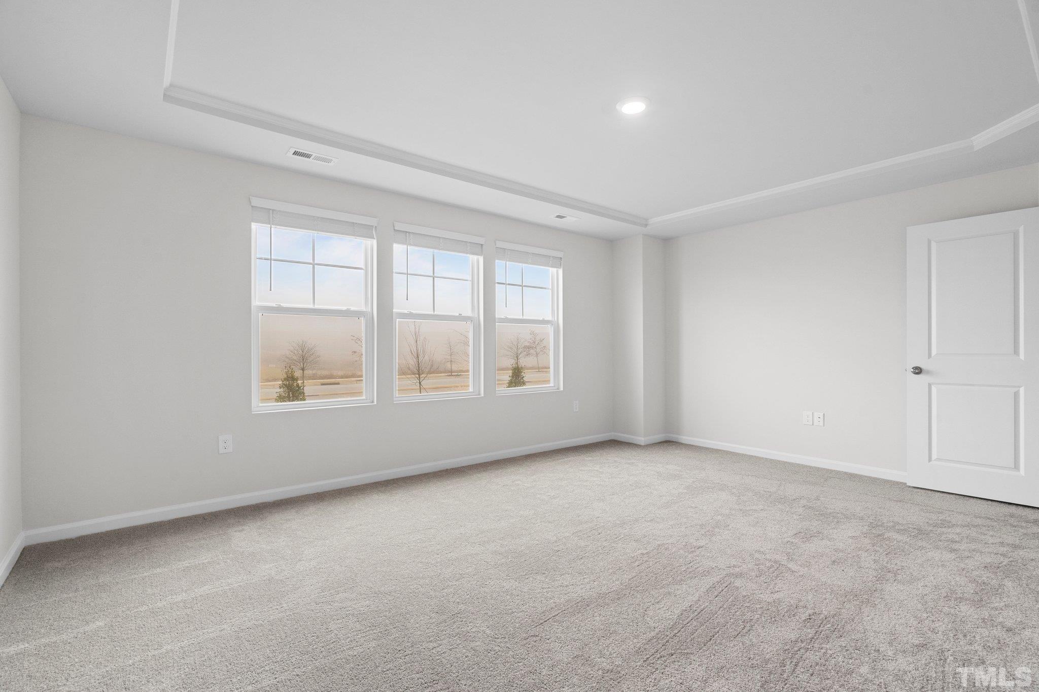 5060 Tura Street Raleigh, NC 27610 - Photo 26 of 50 an empty room with windows