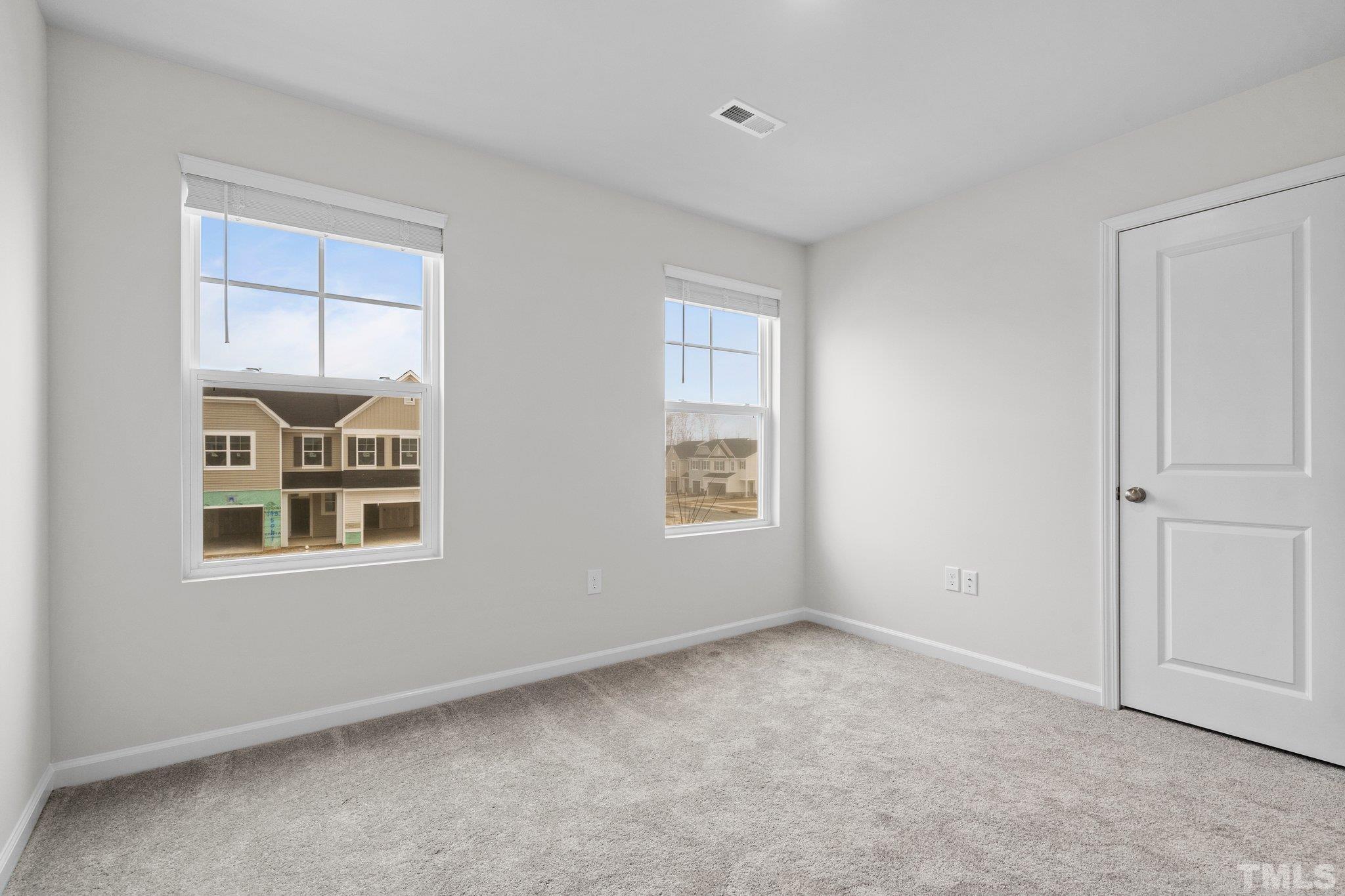 5060 Tura Street Raleigh, NC 27610 - Photo 32 of 50 an empty room with a window