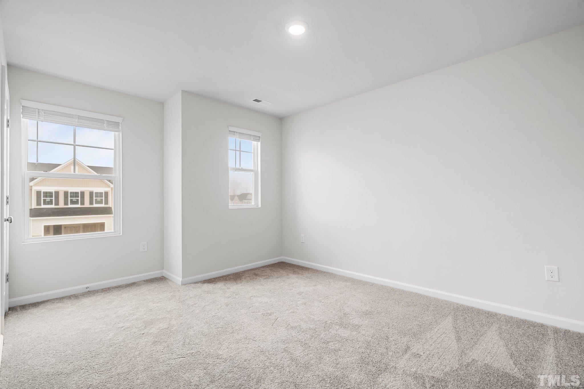 5060 Tura Street Raleigh, NC 27610 - Photo 33 of 50 an empty room with windows