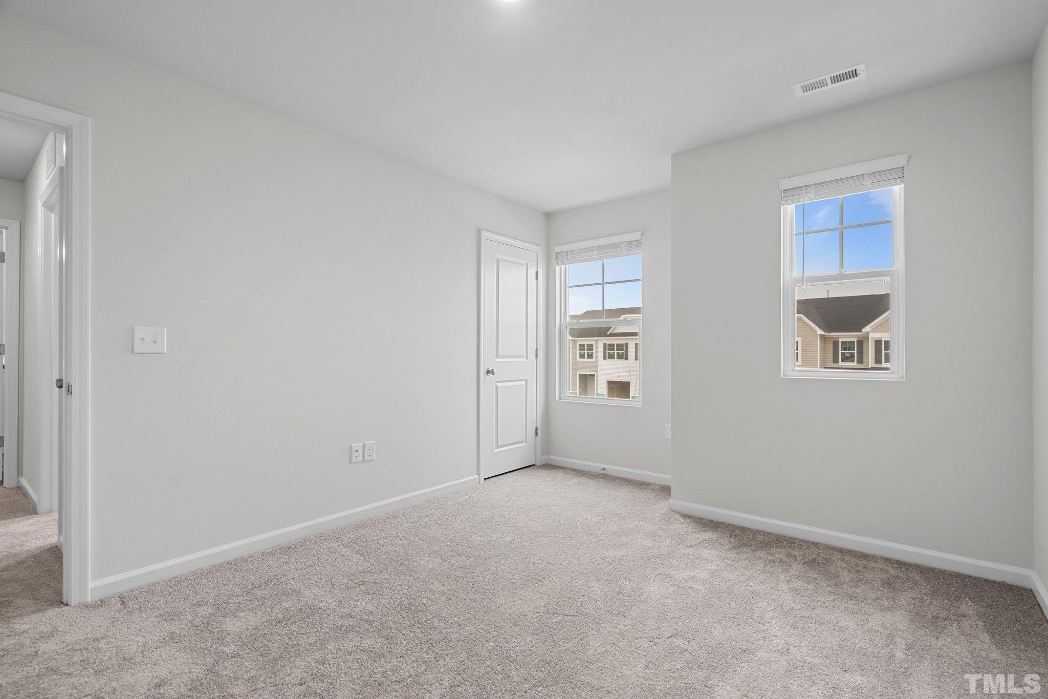 5060 Tura Street Raleigh, NC 27610 - Photo 34 of 50 an empty room with windows
