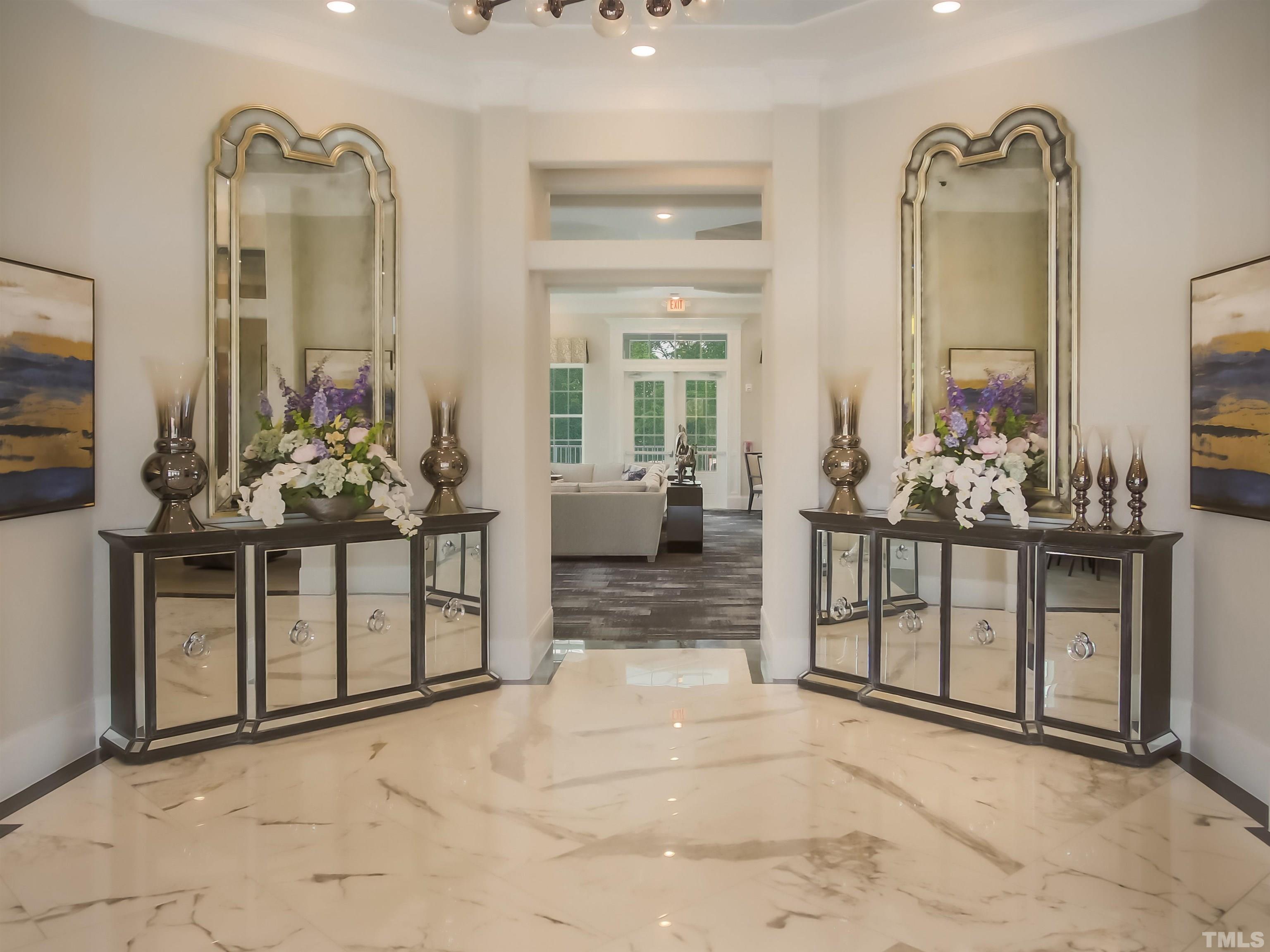 5060 Tura Street Raleigh, NC 27610 - Photo 37 of 50 a view of a hallway with dining table and chairs