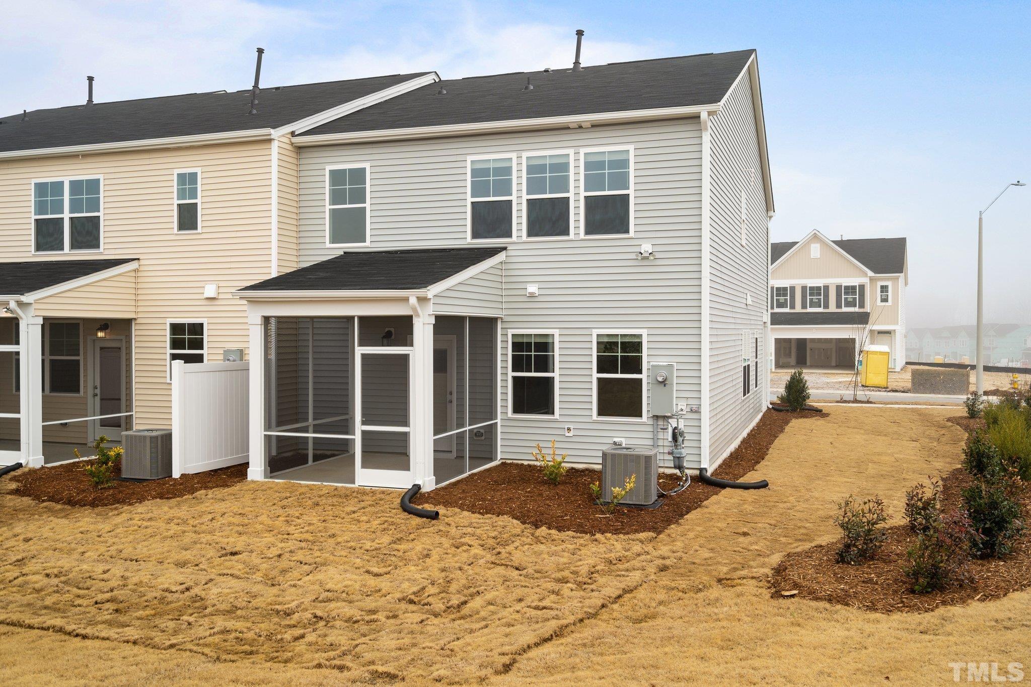 5060 Tura Street Raleigh, NC 27610 - Photo 4 of 50 a front view of a house with a yard