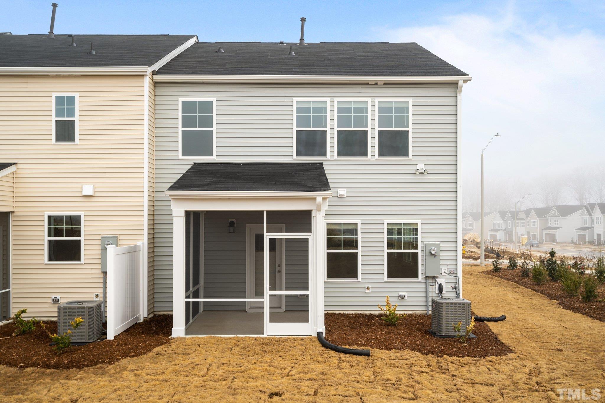 5060 Tura Street Raleigh, NC 27610 - Photo 5 of 50 a front view of a house with a yard