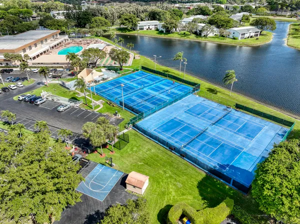 an aerial view of a house with a lake view