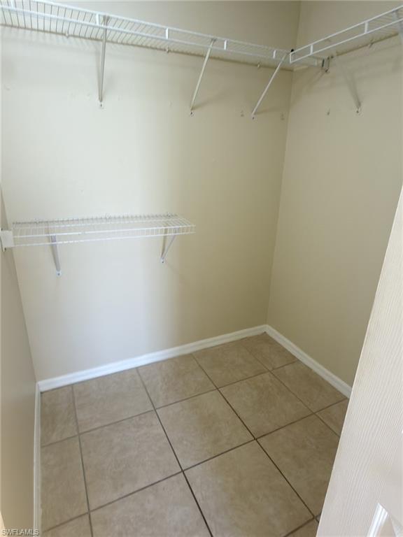 2513 48th Street Southwest Lehigh Acres, FL 33976 - Photo 14 of 22 a view of a room with racks on the wall