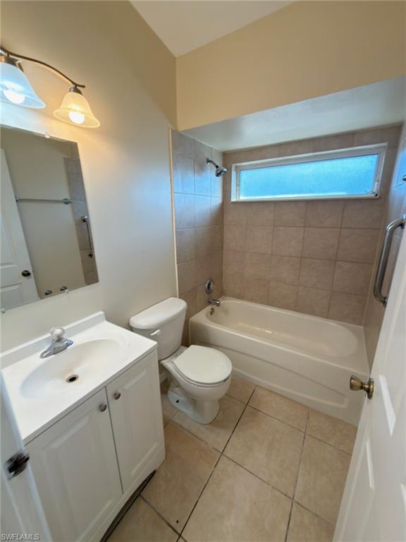 2513 48th Street Southwest Lehigh Acres, FL 33976 - Photo 17 of 22 a bathroom with a sink a toilet and shower