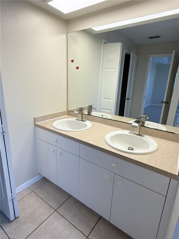 2513 48th Street Southwest Lehigh Acres, FL 33976 - Photo 5 of 22 a bathroom with a sink and a mirror