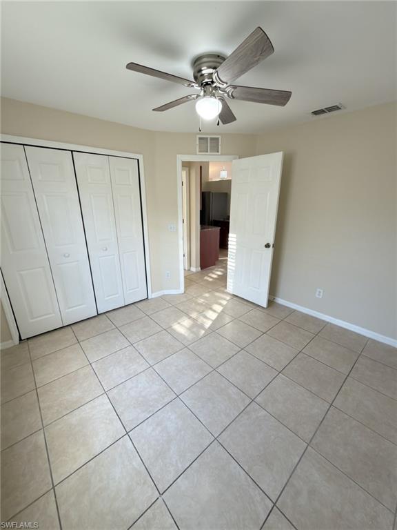 2513 48th Street Southwest Lehigh Acres, FL 33976 - Photo 6 of 22 a view of a livingroom with a ceiling fan and window