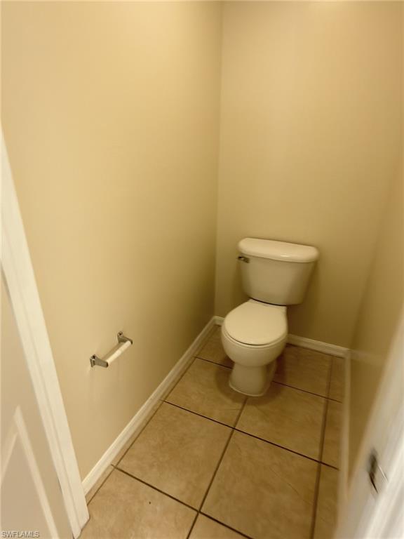 2513 48th Street Southwest Lehigh Acres, FL 33976 - Photo 7 of 22 a white toilet sitting next to a white sink