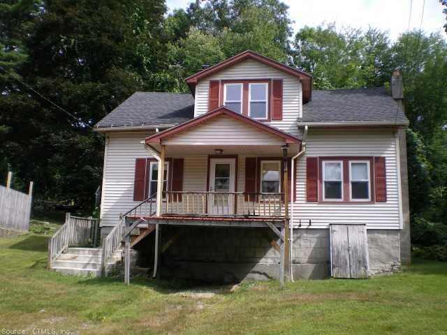 34 Buckley Hill Road Thompson, CT 06255 - Photo 1 of 1 a front view of a house with a yard