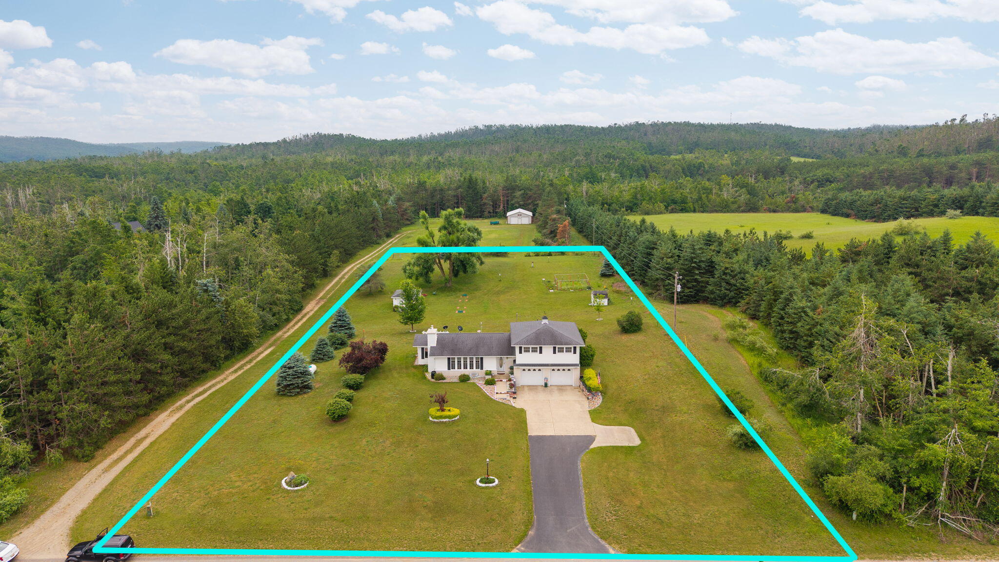 975 Poquette Road Gaylord, MI 49735 - Photo 7 of 57 78-web-or-mls-3-print-DJI_20250707120349