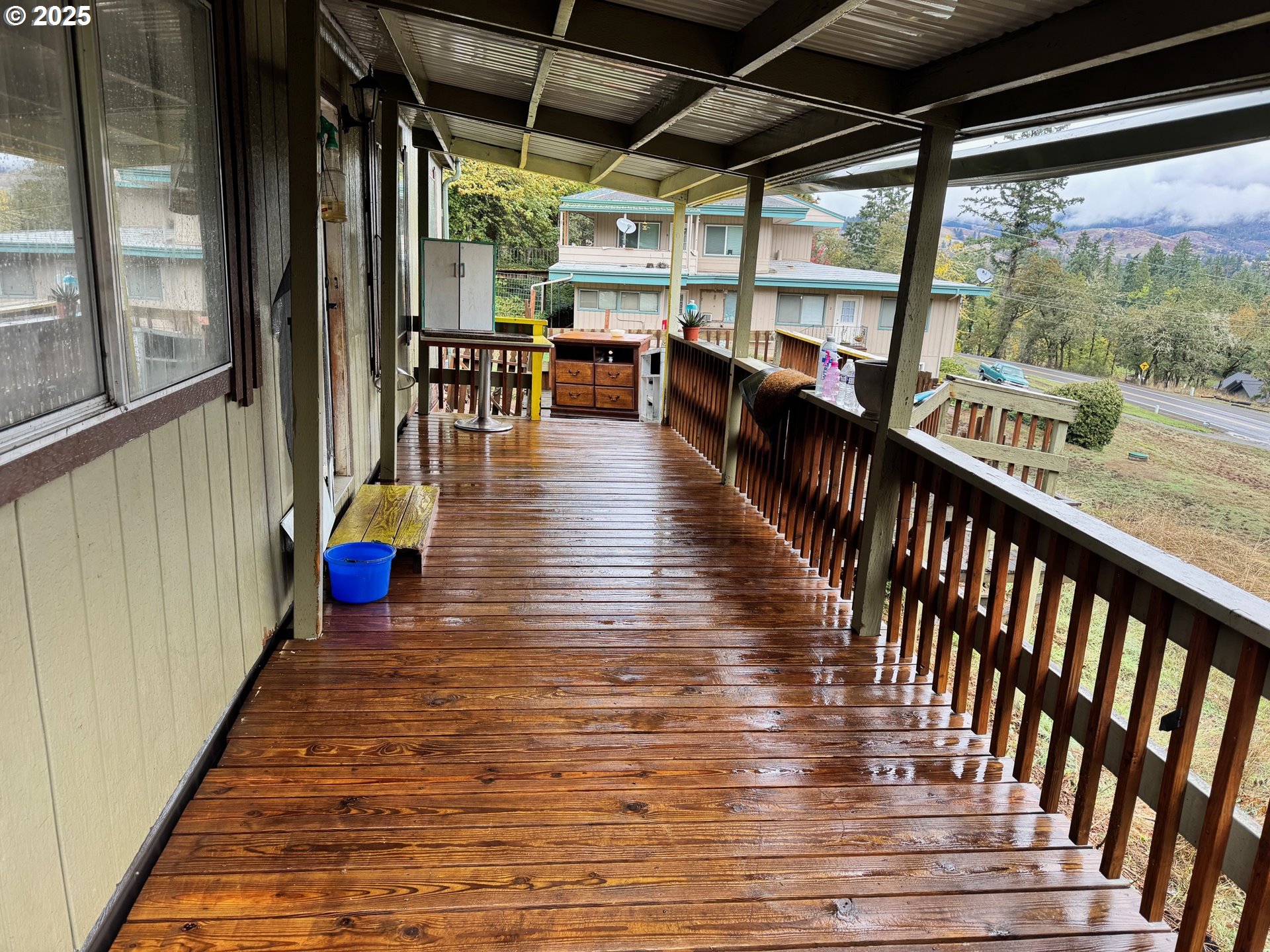 141 West River Ridge Avenue Roseburg, OR 97471 - Photo 15 of 20 a view of a porch with wooden floor
