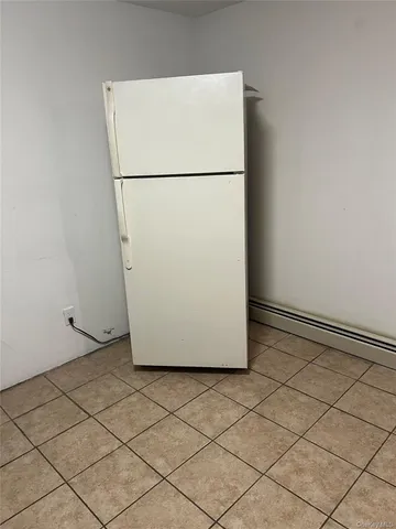 a white refrigerator freezer and a dishwasher