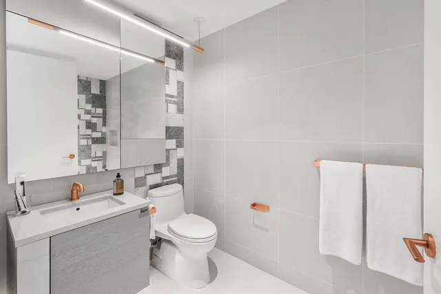 a bedroom with a large bed and a large window