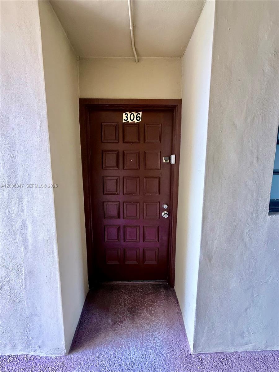 10835 Southwest 112th Avenue, Unit 306 Miami, FL 33176 - Photo 4 of 19 a view of wooden door
