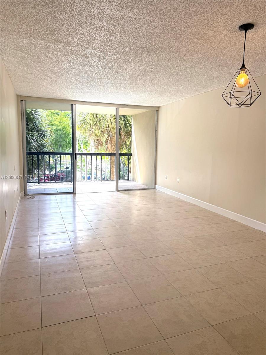 10835 Southwest 112th Avenue, Unit 306 Miami, FL 33176 - Photo 6 of 19 a view of an empty room with a window