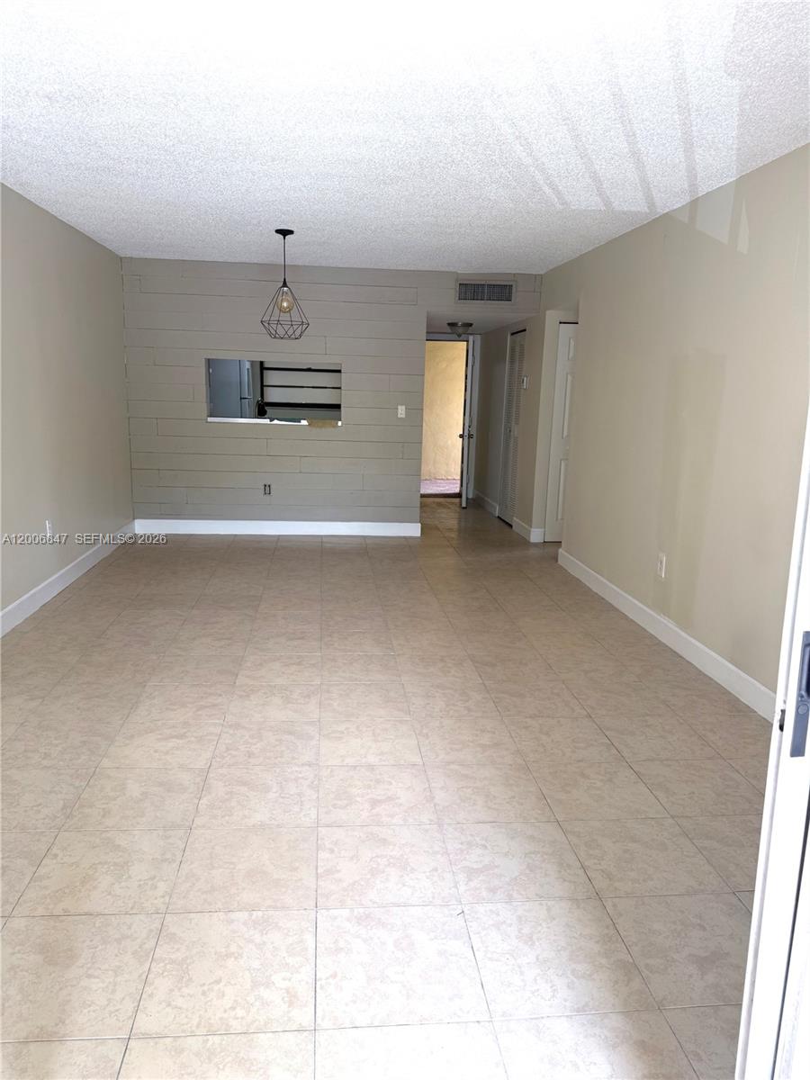 10835 Southwest 112th Avenue, Unit 306 Miami, FL 33176 - Photo 8 of 19 a view of a kitchen with a sink and a dishwasher cabinets