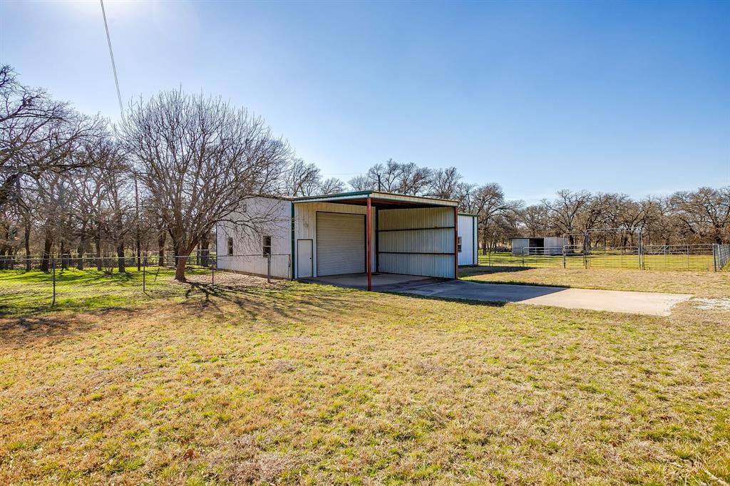 4763 Blue Flat Road Gordon, TX 76453 - Photo 20 of 40 a view of a swimming pool with an outdoor space and seating area