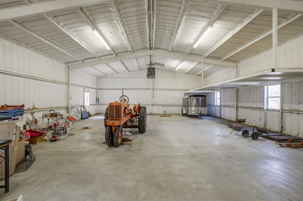 4763 Blue Flat Road Gordon, TX 76453 - Photo 24 of 40 a view of a garage with storage