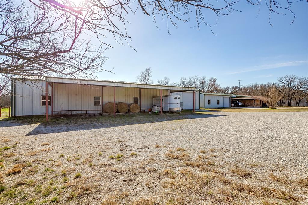 4763 Blue Flat Road Gordon, TX 76453 - Photo 25 of 40 a view of a house with a snow in the yard