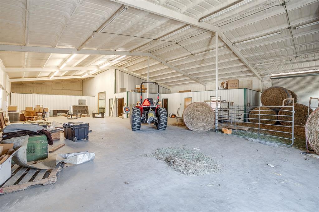 4763 Blue Flat Road Gordon, TX 76453 - Photo 26 of 40 a view of a garage with table and chairs