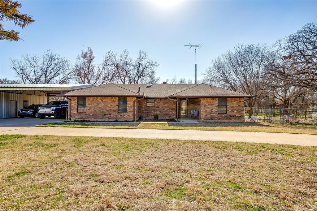 4763 Blue Flat Road Gordon, TX 76453 - Photo 3 of 40 a front view of a house with swimming pool