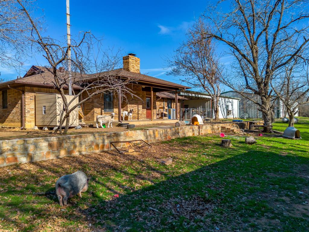 4763 Blue Flat Road Gordon, TX 76453 - Photo 40 of 40 a front view of a house with garden