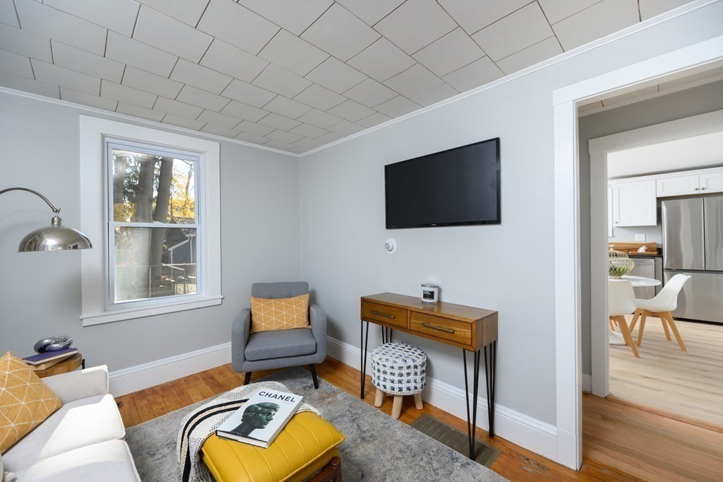 9 Bank Street Abington, MA 02351 - Photo 11 of 16 a living room with furniture and a flat screen tv