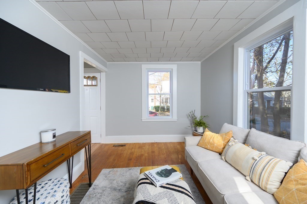 9 Bank Street Abington, MA 02351 - Photo 12 of 16 a living room with furniture and a flat screen tv
