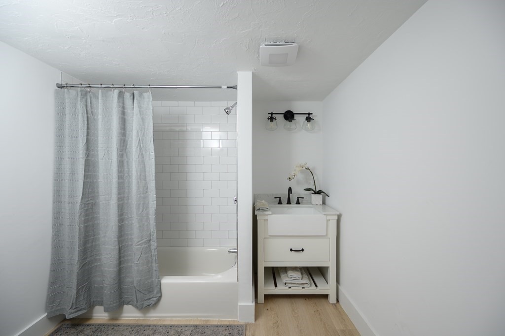 9 Bank Street Abington, MA 02351 - Photo 13 of 16 a bathroom with a sink toilet and shower