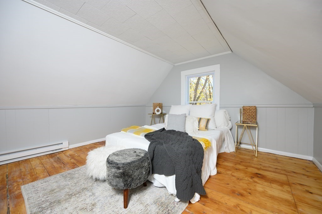 9 Bank Street Abington, MA 02351 - Photo 14 of 16 a bedroom with a bed and a painting on the wall