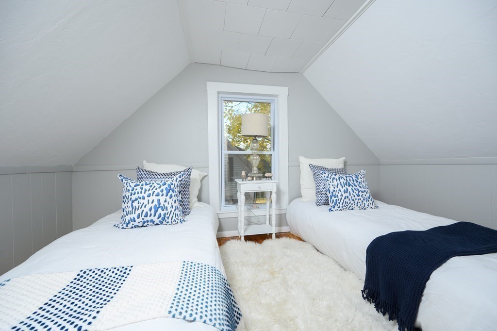 9 Bank Street Abington, MA 02351 - Photo 15 of 16 a bedroom with a large bed and a couch