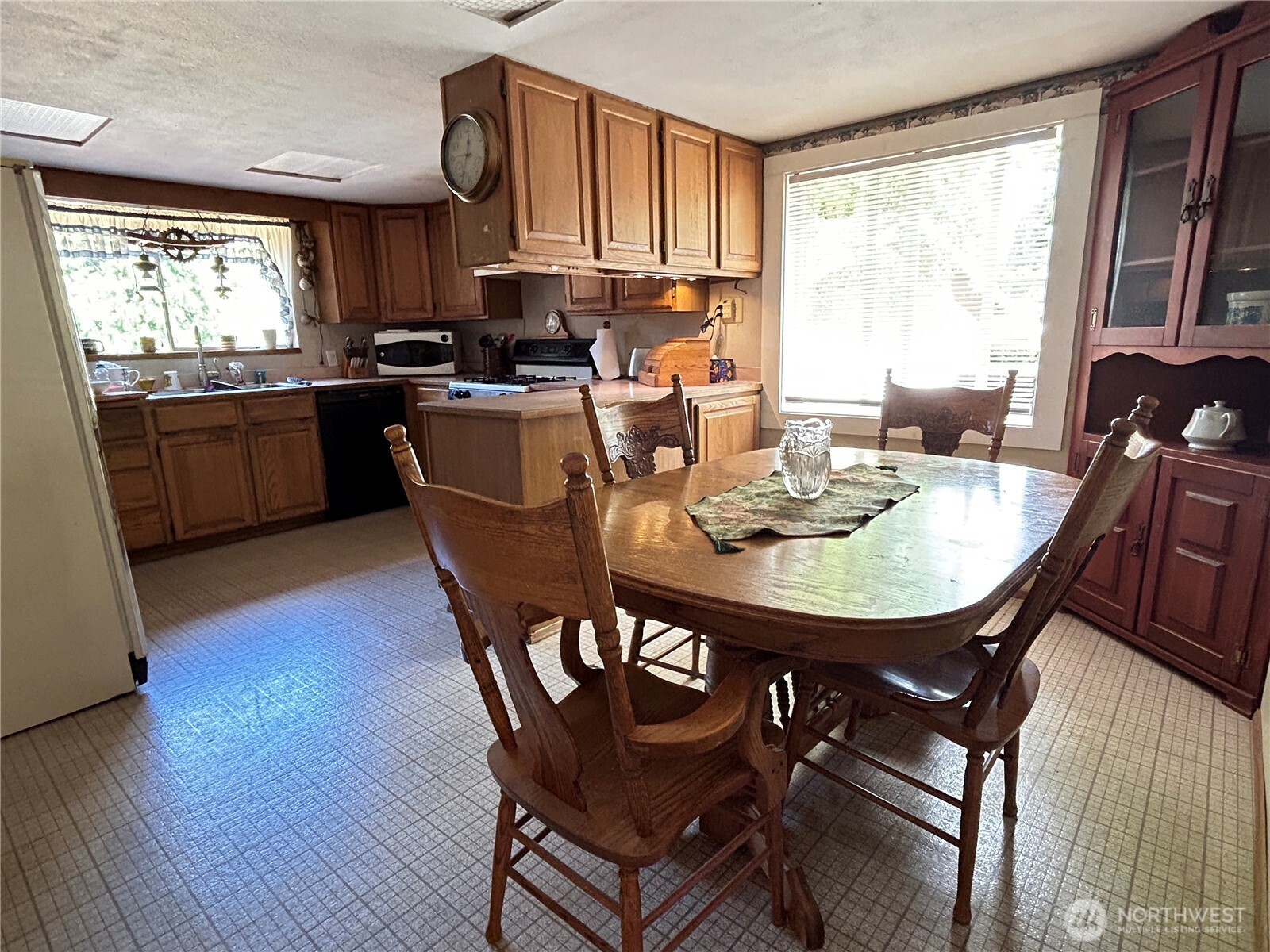 7707 203rd Street Southwest Edmonds, WA 98026 - Photo 6 of 20 a view of a dining room with furniture window and wooden floor