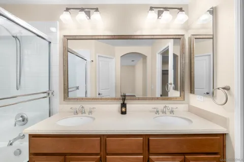 a bathroom with a sink and a mirror