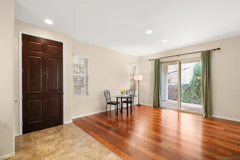 a view of a livingroom with furniture window and wooden floor