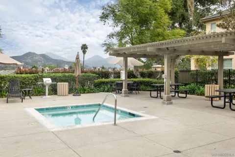 a view of a patio with a table and chairs