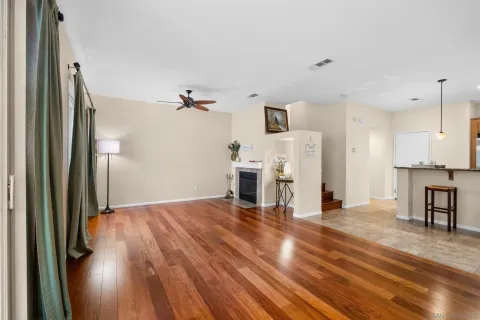 a view of a living room with wooden floor