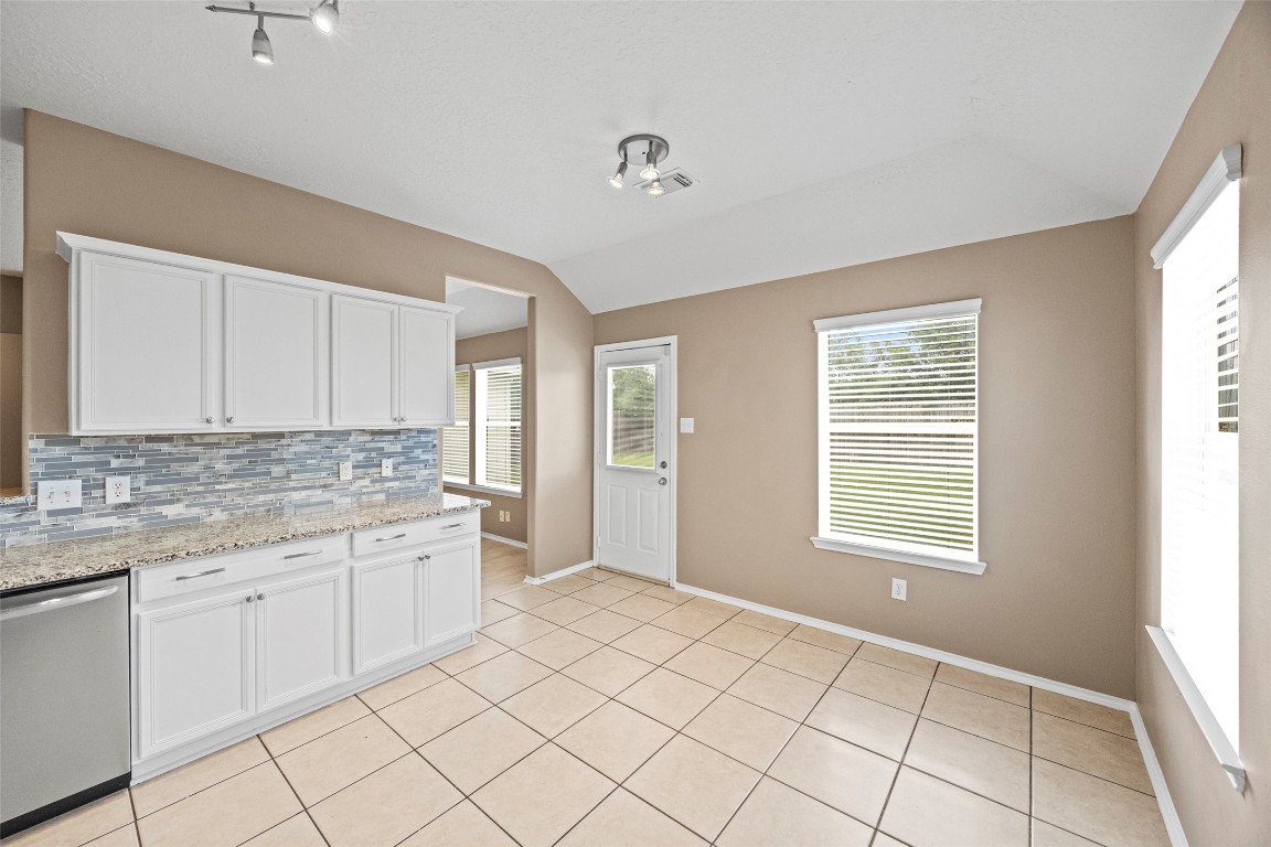 9510 Barr Spring Drive Humble, TX 77396 - Photo 12 of 27 a view of a kitchen counter space with windows