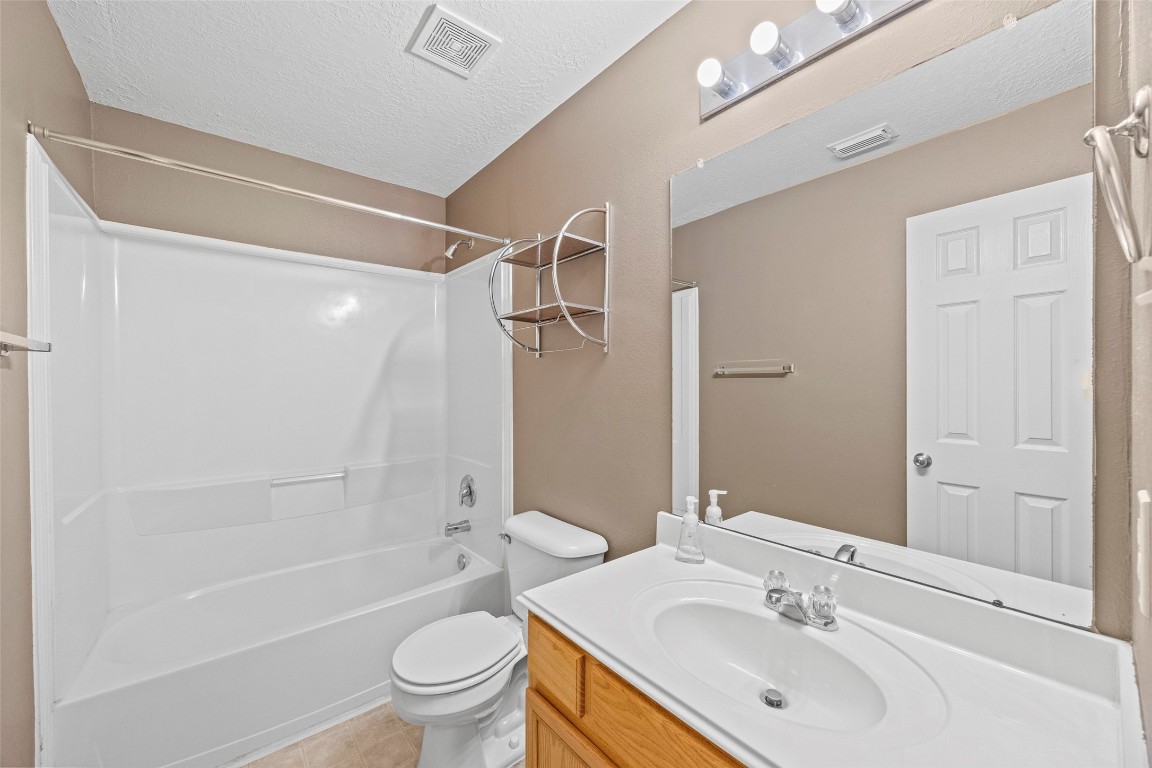 9510 Barr Spring Drive Humble, TX 77396 - Photo 14 of 27 a bathroom with a sink toilet tub and shower