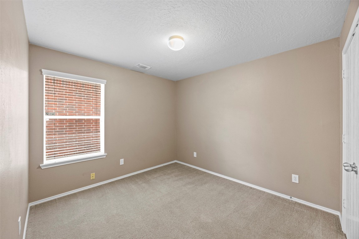 9510 Barr Spring Drive Humble, TX 77396 - Photo 15 of 27 a view of an empty room with a window