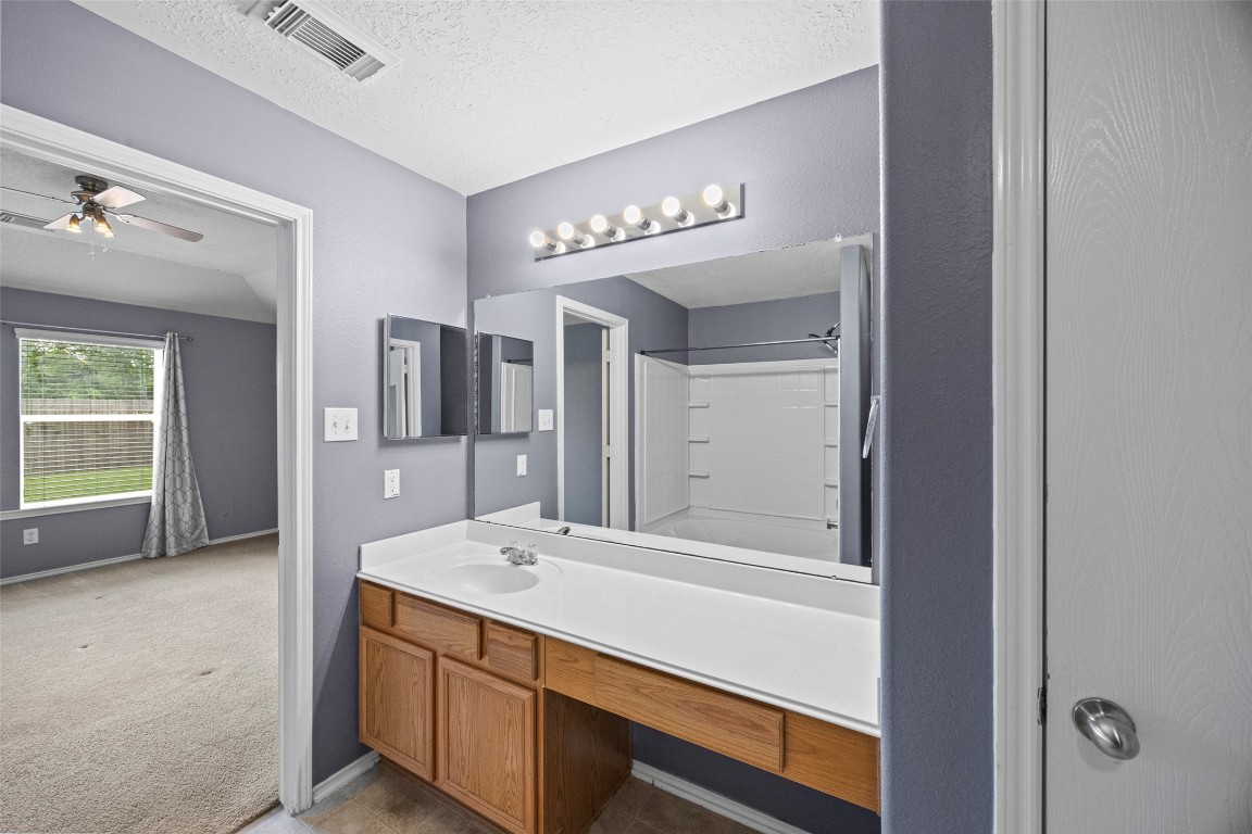 9510 Barr Spring Drive Humble, TX 77396 - Photo 19 of 27 a bathroom with a sink double vanity and a mirror