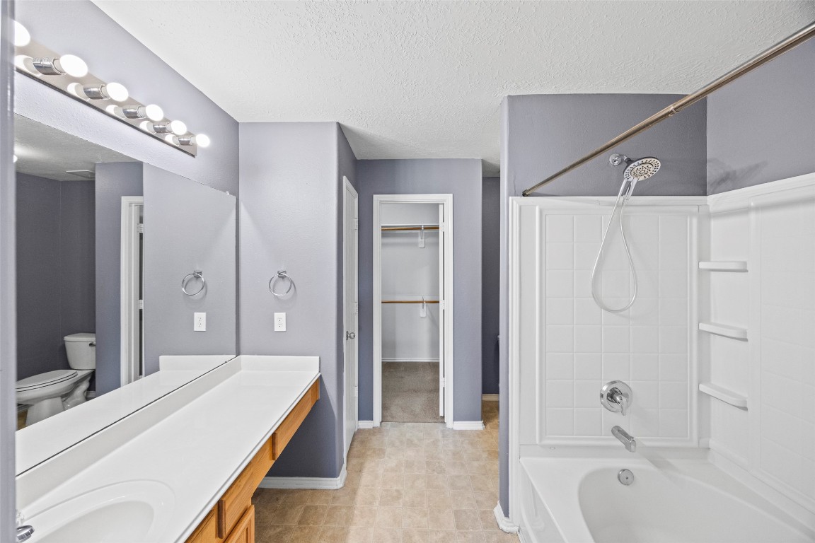 9510 Barr Spring Drive Humble, TX 77396 - Photo 20 of 27 a spacious bathroom with a tub shower and mirror