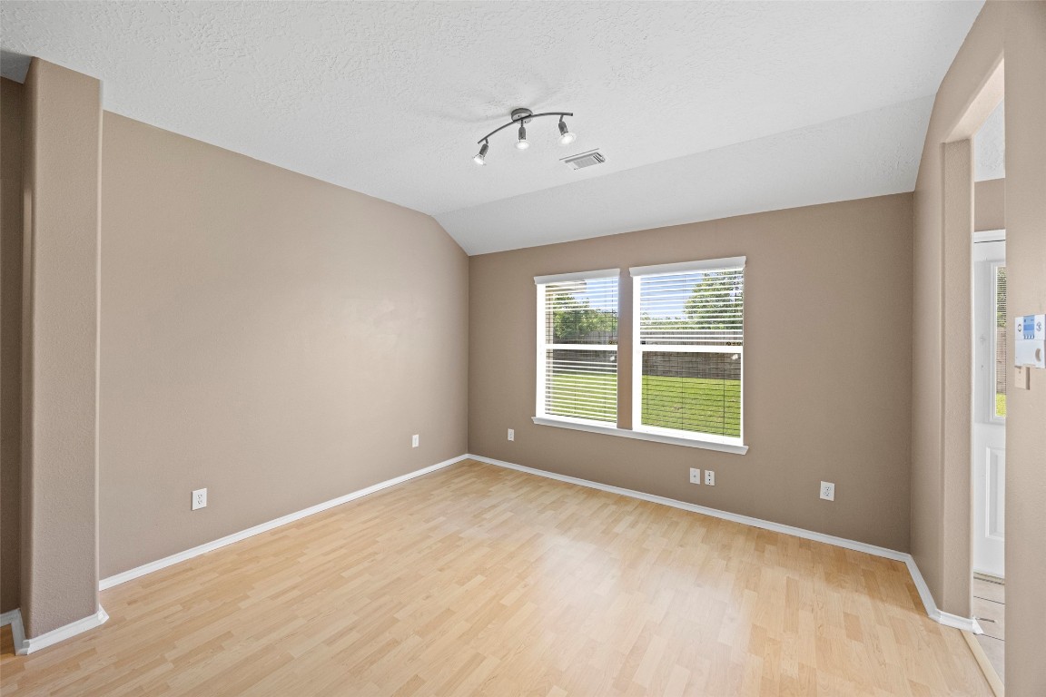 9510 Barr Spring Drive Humble, TX 77396 - Photo 9 of 27 a view of an empty room with a window