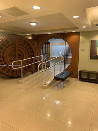 a view of a livingroom with furniture and staircase