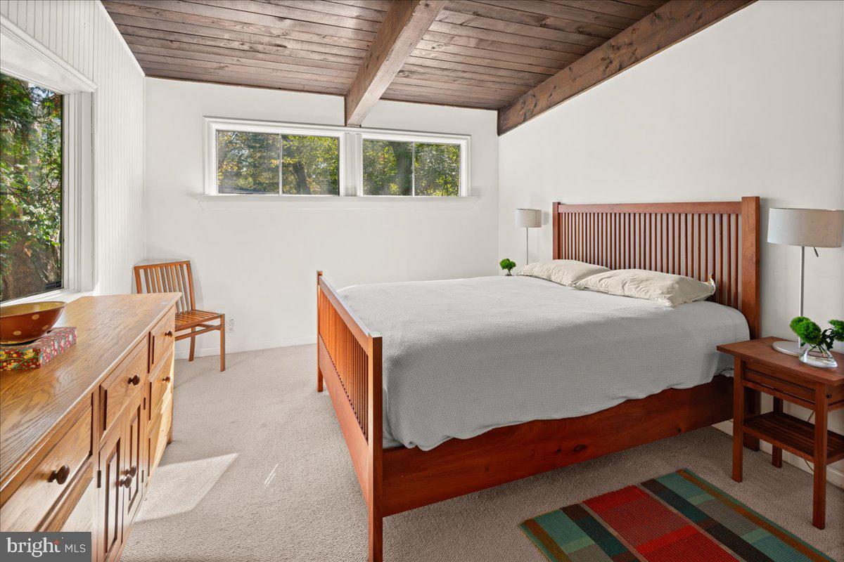 75 Clover Lane Princeton, NJ 08540 - Photo 28 of 37 a bedroom with a bed and a table in it