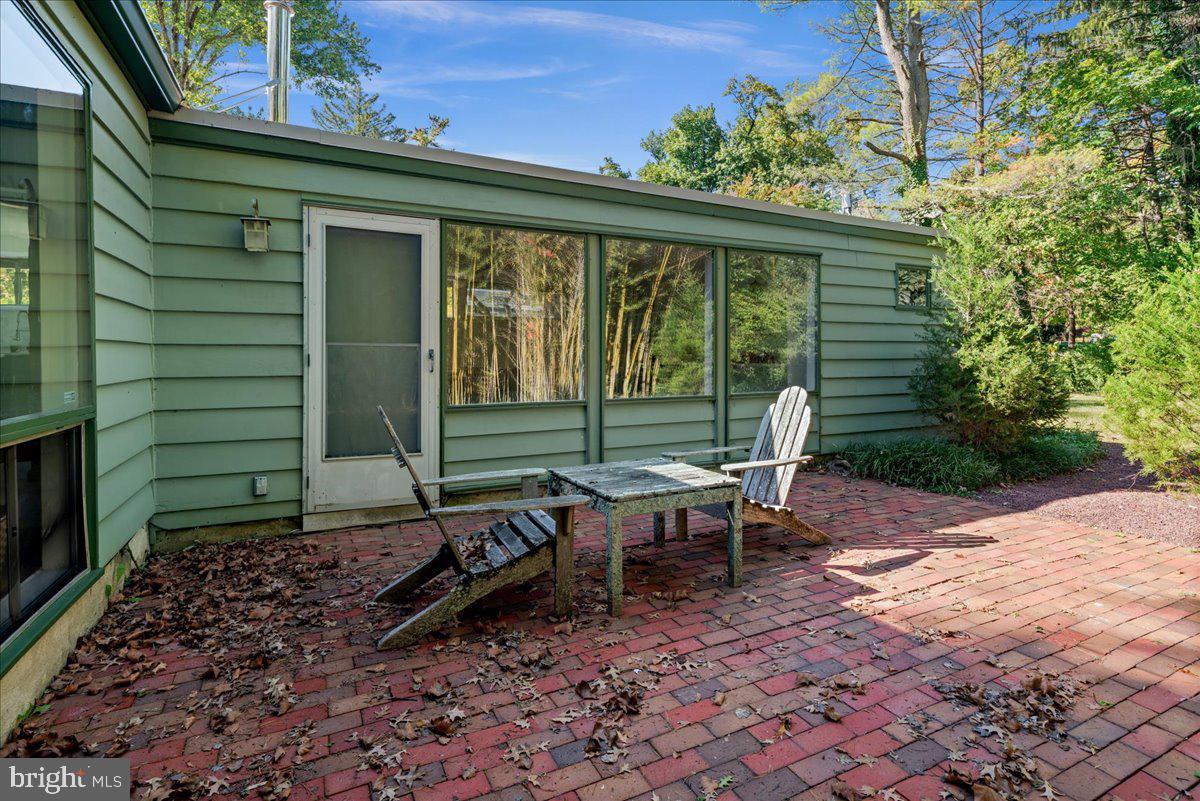 75 Clover Lane Princeton, NJ 08540 - Photo 34 of 37 a backyard of a house with outdoor seating