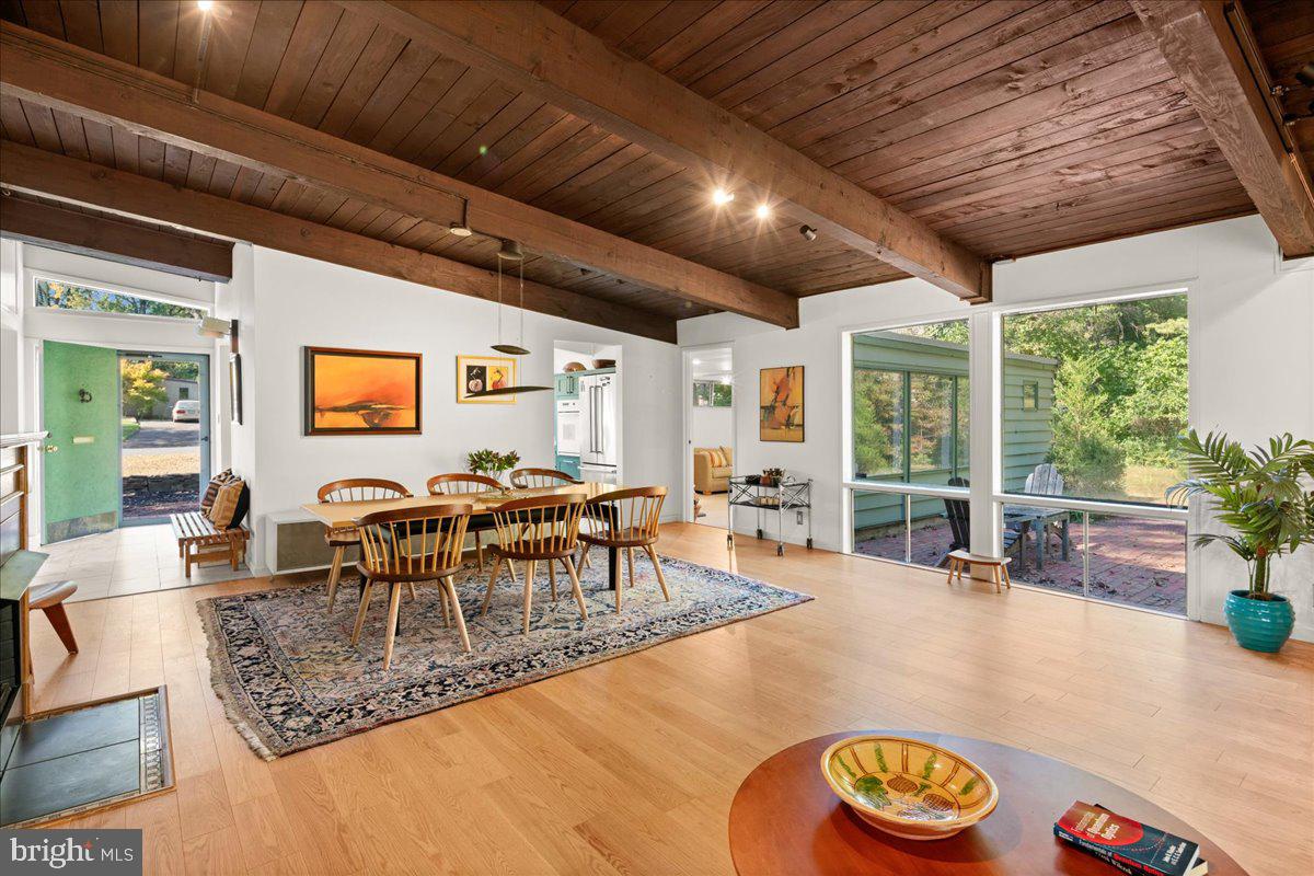 75 Clover Lane Princeton, NJ 08540 - Photo 6 of 37 a dining room with furniture a rug and a large window