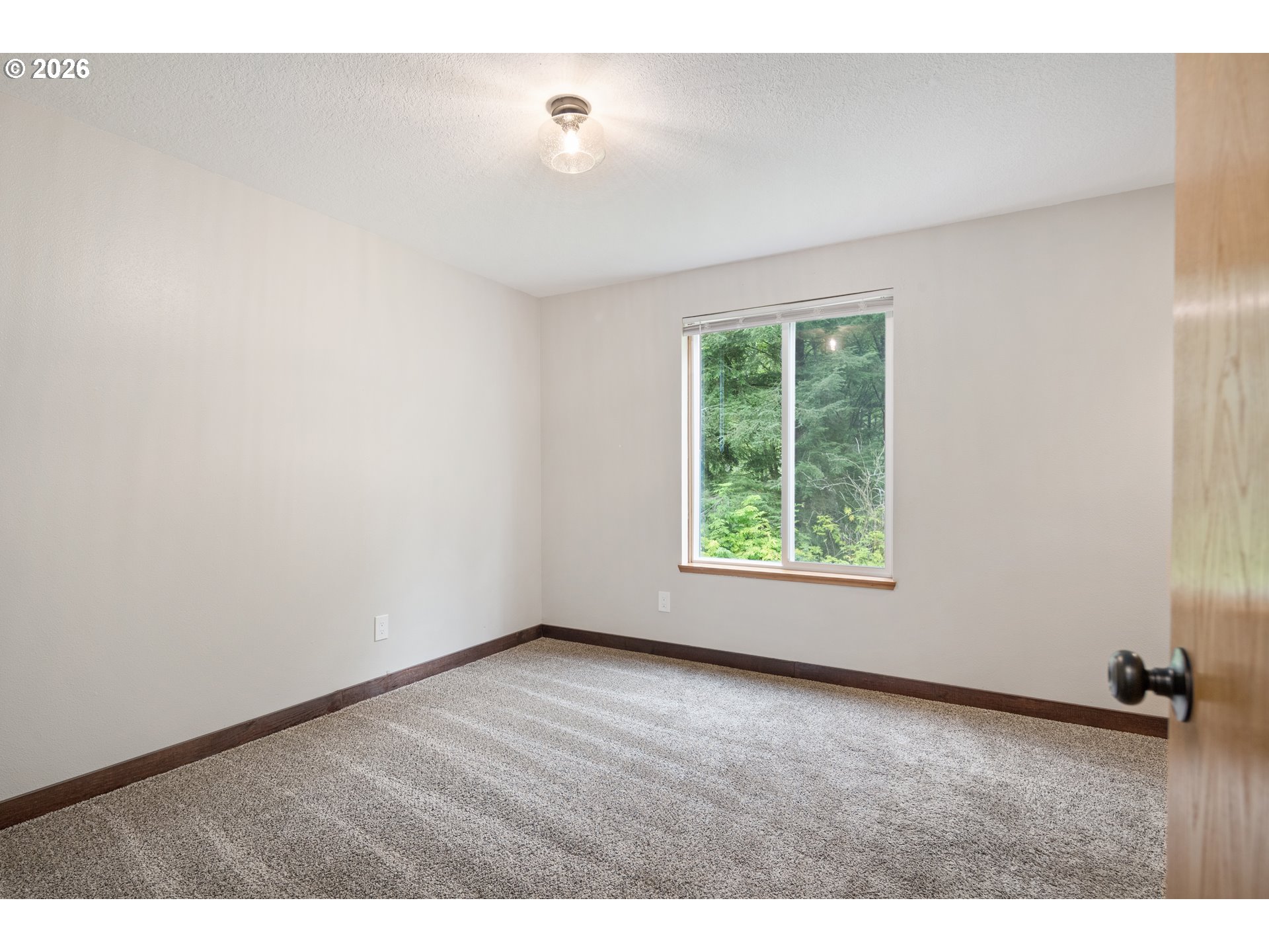 650 Marvin Road Tillamook, OR 97141 - Photo 29 of 48 a view of an empty room with a window